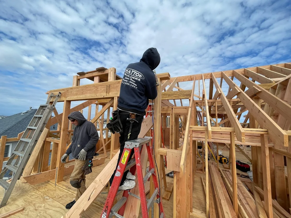 Mattoe Builders crew framing an upper level roofline