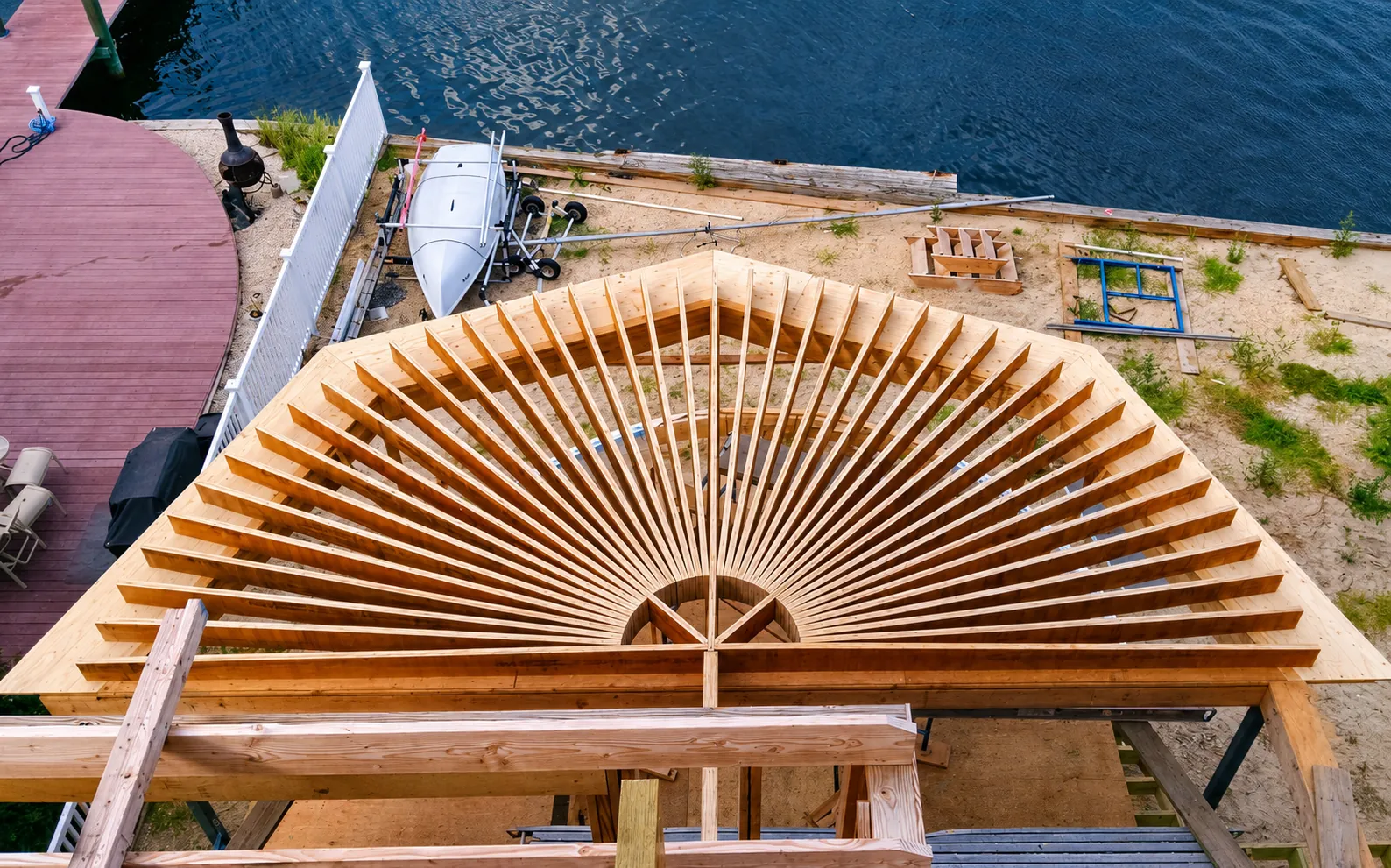 Aerial view of radial fan deck framing on a waterfront build