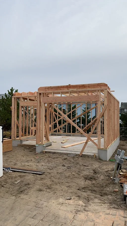Ground-level wall framing set on a new foundation